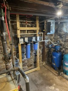 Corner of a basement, before well pump install