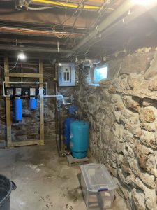 Corner of a basement, before well pump install
